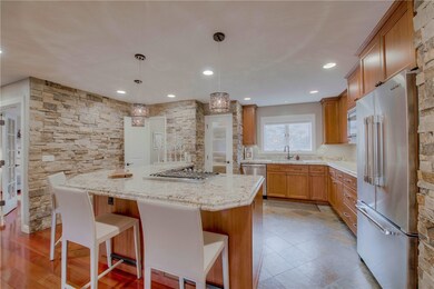 Kitchen with Telluride stone walls, granite, pantr