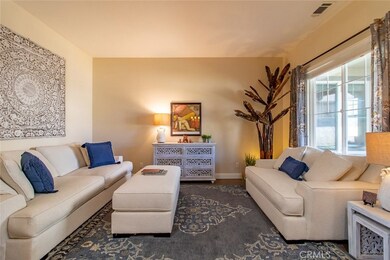 Formal living room with large picture windows.