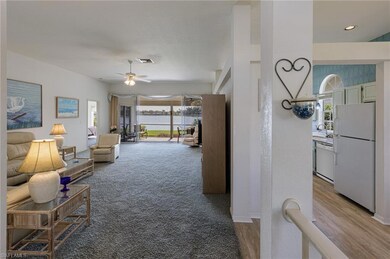 Look through the living room & lanai to the beauti
