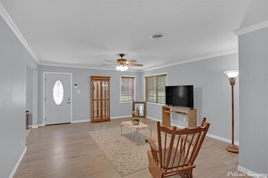 Large living room with pretty moulding and paint c