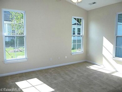 Master Bedroom. Large master suite has a dramatic cathedral ceiling, ceiling fan and lots of natural light.