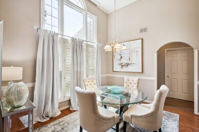 Dining area with a notable chandelier, crown moldi