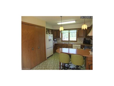 The kitchen provides lots of cabinet and counter s