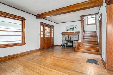 Pretty front doors and original wood trim everywhe