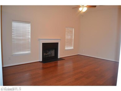 Living Room. Living room with new laminate flooring and vaulted ceilings. Fireplace.