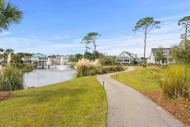 Exterior space featuring a lawn and a water view