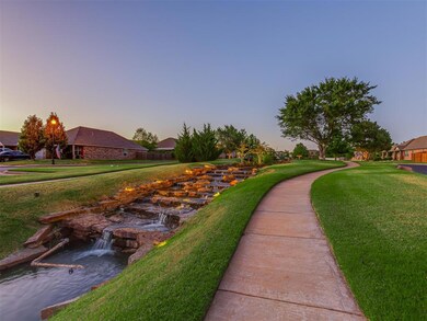 View of property's community with a yard