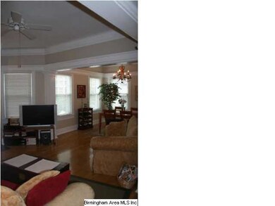 Intricate crown molding around the lofty ceilings