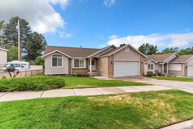 Single story home featuring an attached garage, brick siding, driveway, and a shingled roof