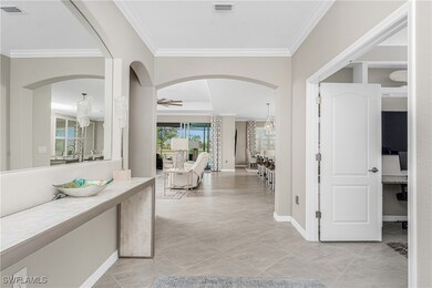 Corridor featuring crown molding, baseboards, and