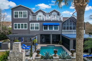 This home features a resort-like pool, outdoor kit