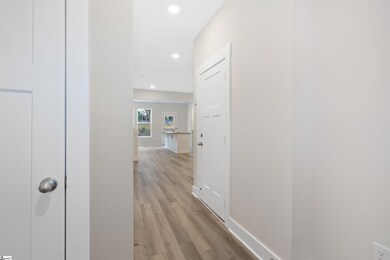Hall closet and powder room off entry. *Model Home