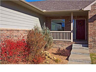 Cute front porch has room for patio or furniture p