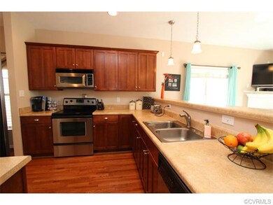 Overlooking the great room, the kitchen allows the