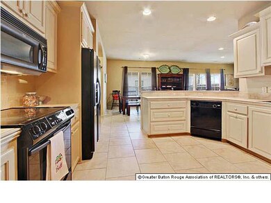 Open Kitchen. Has bar, opens to dinning area, open