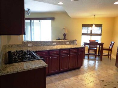Kitchen - Designer features with wood cabinetry and stone counters!
