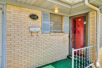 Entrance to property with brick siding