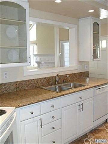 Open Area Over Sink Brings the Downstairs Together