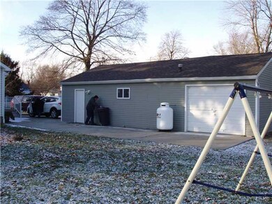 Garage. Side of garage, concrete pad.