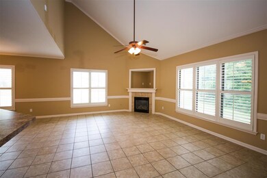 Open to the kitchen is the fabulous hearth room en