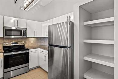 Kitchen with appliances with stainless steel finis