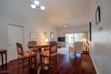 Dining area with ceiling fan with notable chandeli