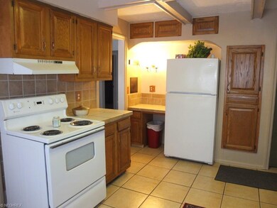 Kitchen has built in desk.
