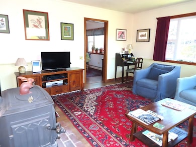LR w/hdwd FLR, new windows, door into dining area