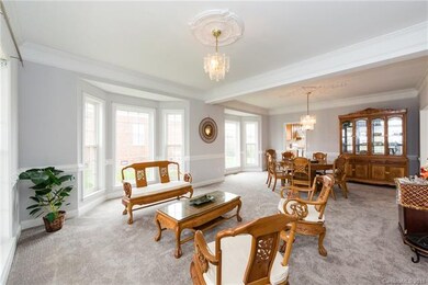 Large sitting area/den with access to dining room