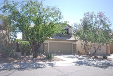 front of home with trees