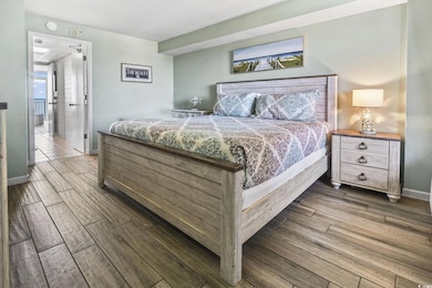 Bedroom with wood finish floors