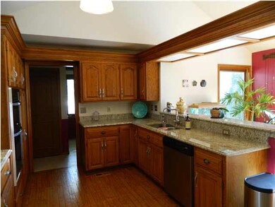 Granite countertops, wood floors, open kitchen!
