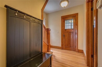 Front entryway coming in from the enclosed front p