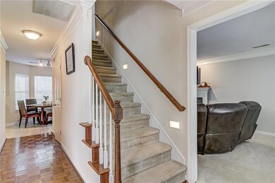 Across the entry is the breakfast room that sits right beside the kitchen. Stairs lead to bedrooms.