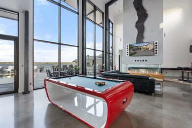 Rec room featuring concrete flooring, expansive w