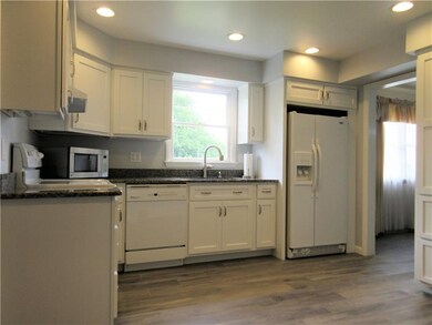 New kitchen with white soft closing cabinets, doub