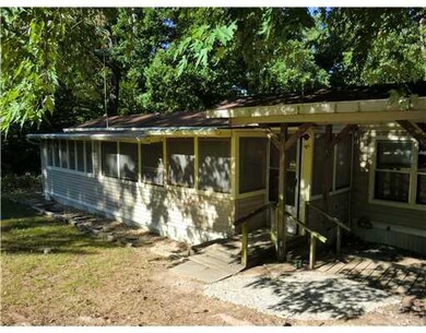 Exterior Front. Shows Built on Porch & Sun Room.....--Spring Season