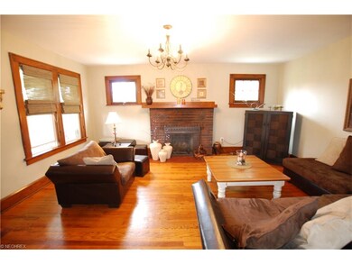 View of Living Room with Fireplace from the Dining