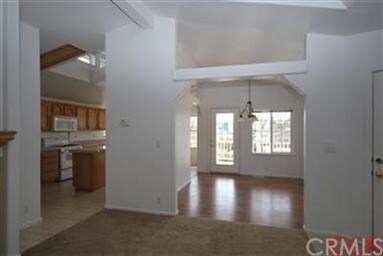 View from living room into kitchen and dining room