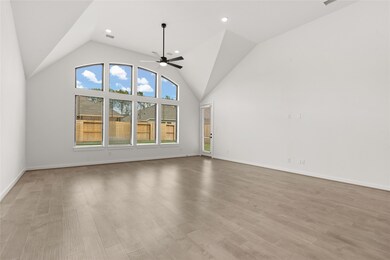 Beautiful family room with lots of windows and high ceiling!