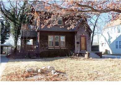 Front view of home with side decks