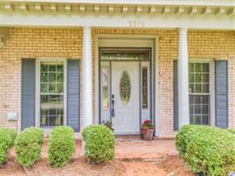 Stately columns, brick front porch, corner lot, le