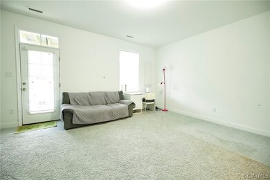 Living room featuring carpet flooring