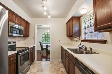 Step saver kitchen with adjacent laundry room and