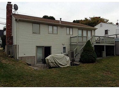 Exterior Back. Rear deck with basement walkout to patio.