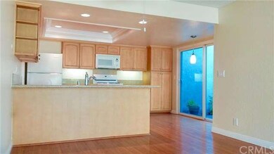 Kitchen w/direct garage access + sliding glass doo