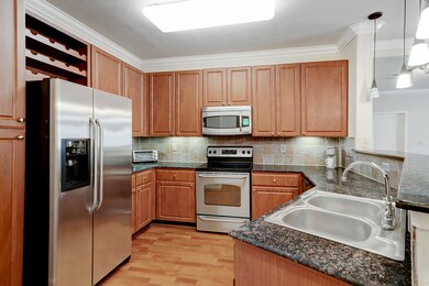 This kitchen includes a double-basin sink, built-i
