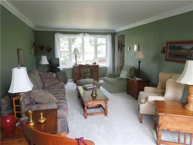 Living Room. Living room has crown molding and bow