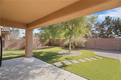 Fenced backyard featuring a patio