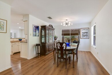 Dining room with a chandelier, light wood-type fl